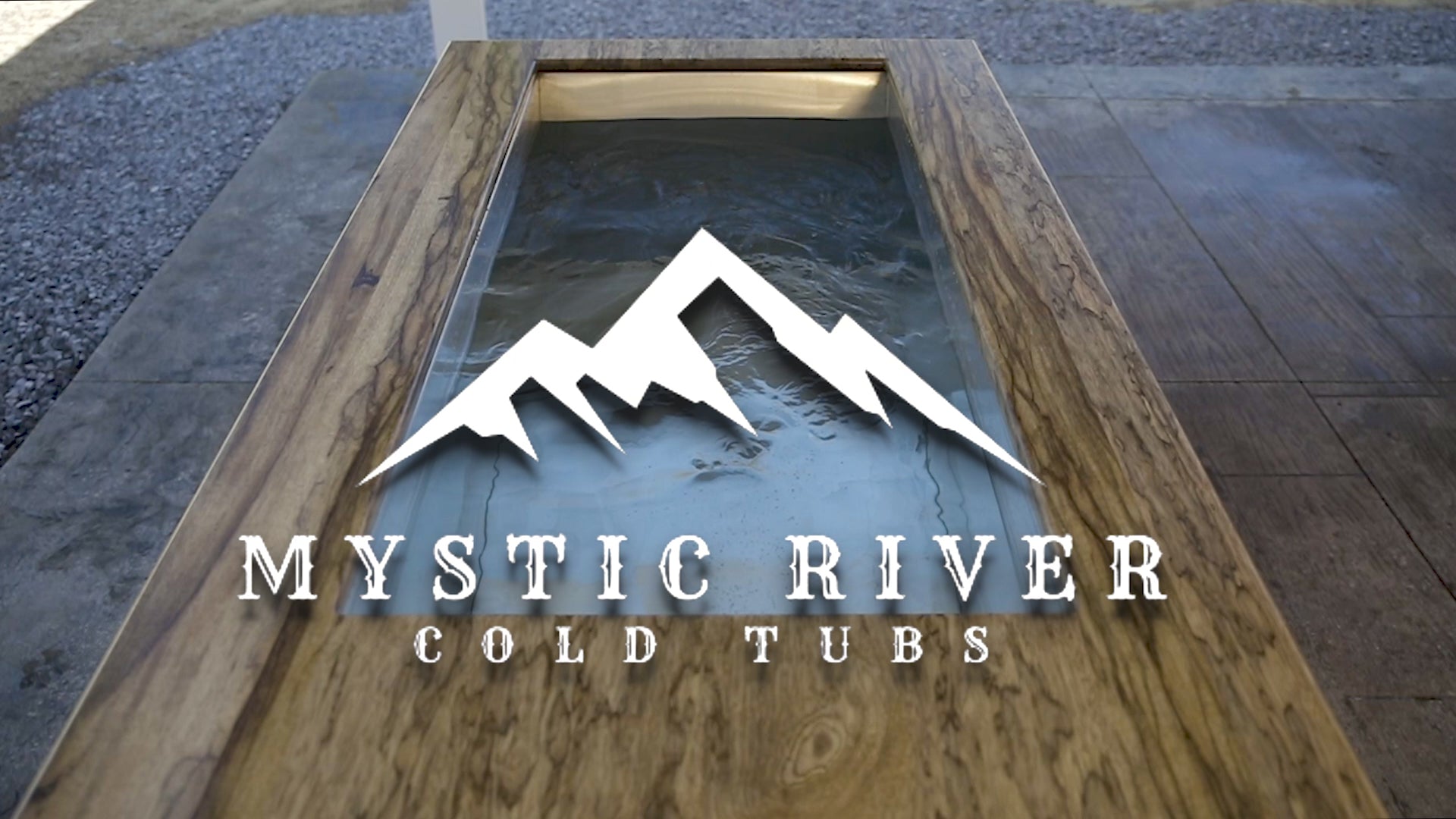 Load video: A woman outside using a Mystic River Cold Tub