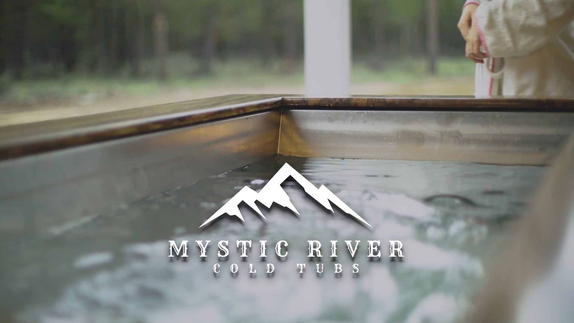 Load video: A woman on a patio using a Mystic River Cold Tub